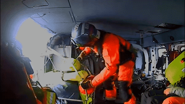 Coast Guard swoops in to save stranded sailors from sinking boat hundreds of miles off coast
